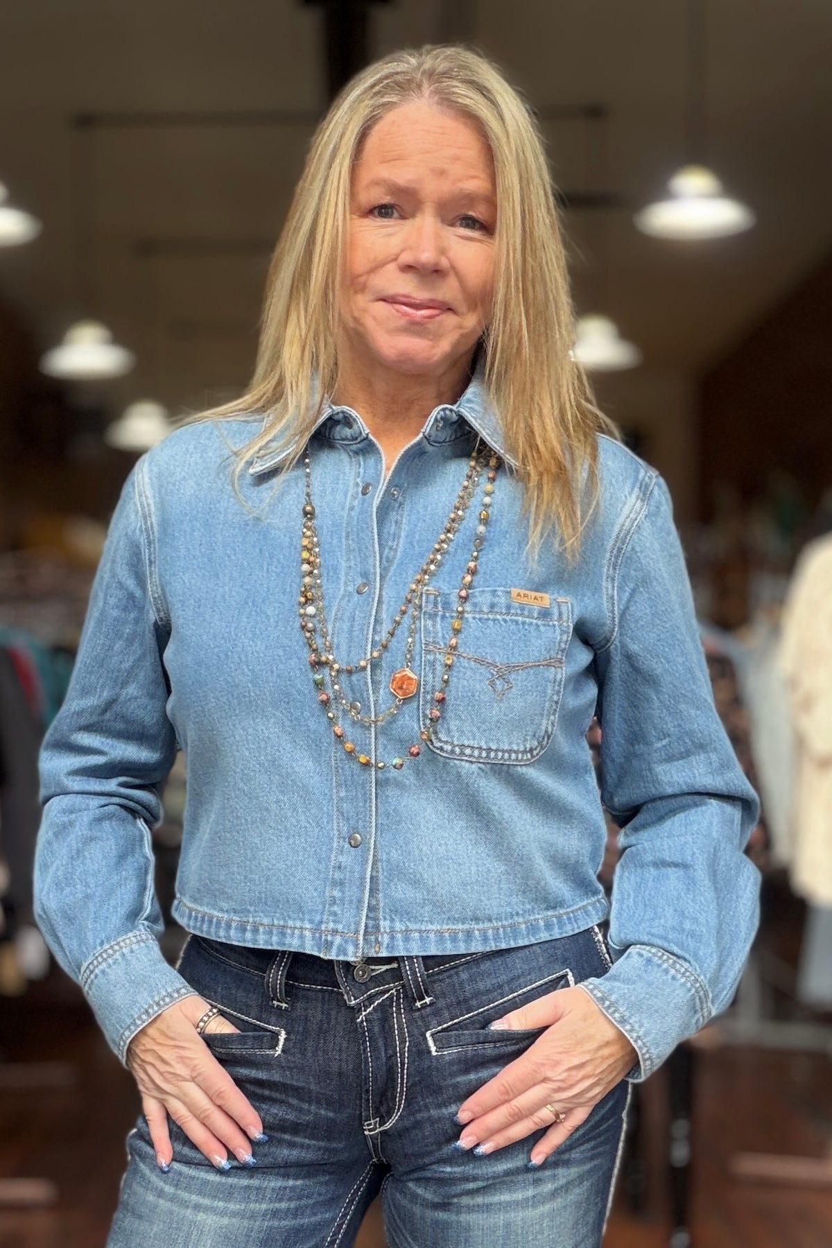 Women’s Cropped Long Sleeve Snapped Denim Shirt by Ariat-Top-Ariat-Gallop 'n Glitz- Women's Western Wear Boutique, Located in Grants Pass, Oregon